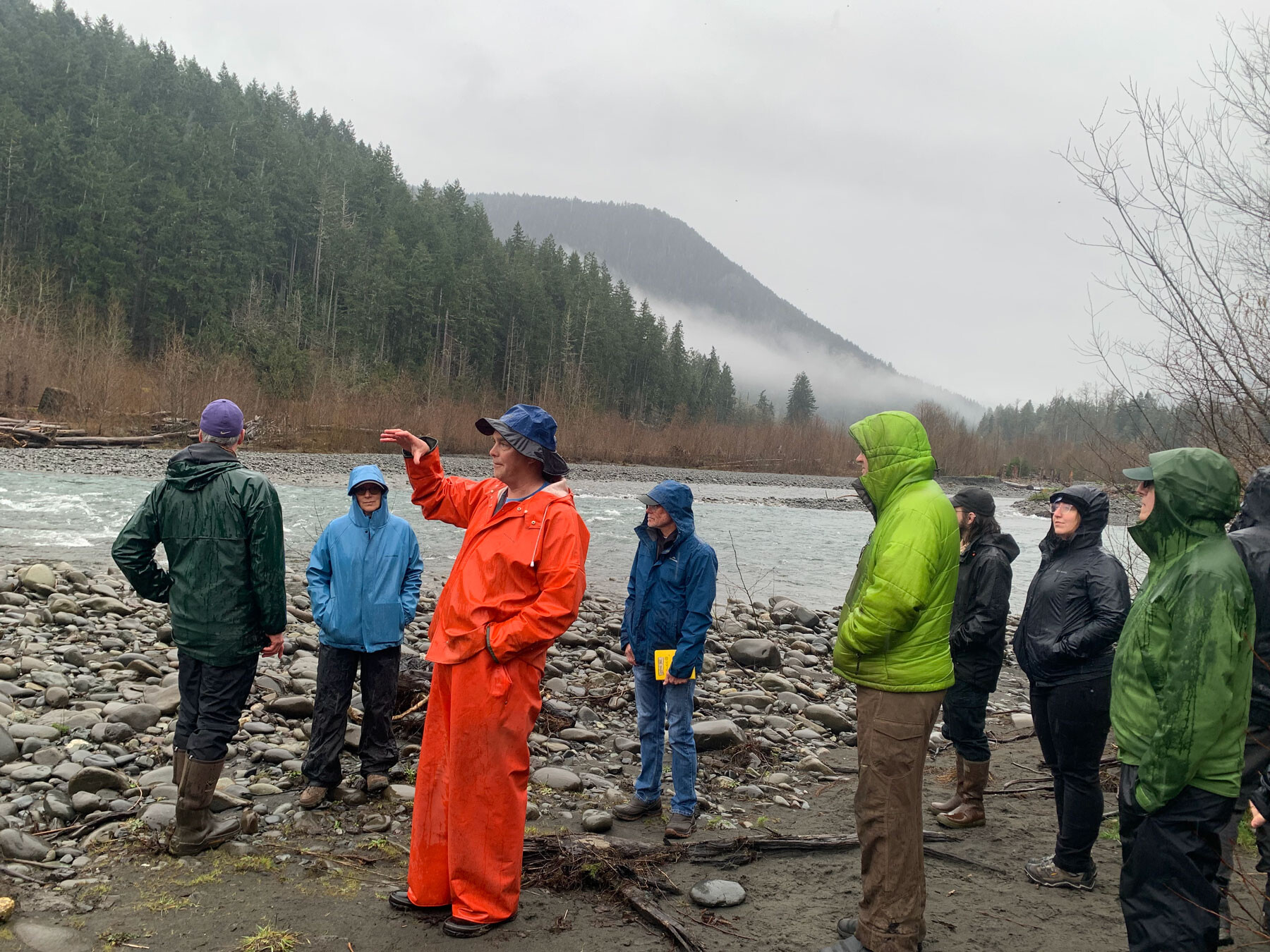 Project Sponsor Randy Johnson speaking with Michelle Cramer and Coleman Byrnes about protection efforts in the Lower Dungeness during a March 2026 site visit.