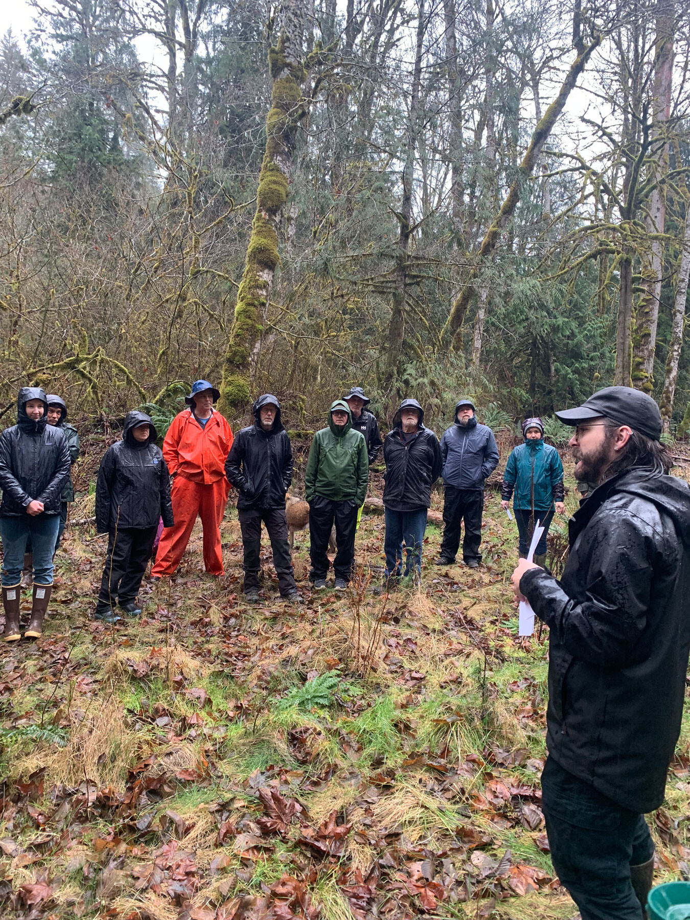 Project Sponsor Jacob Stone speaking with a group about conservation efforts along Indian Creek during a March 2026 site visit.